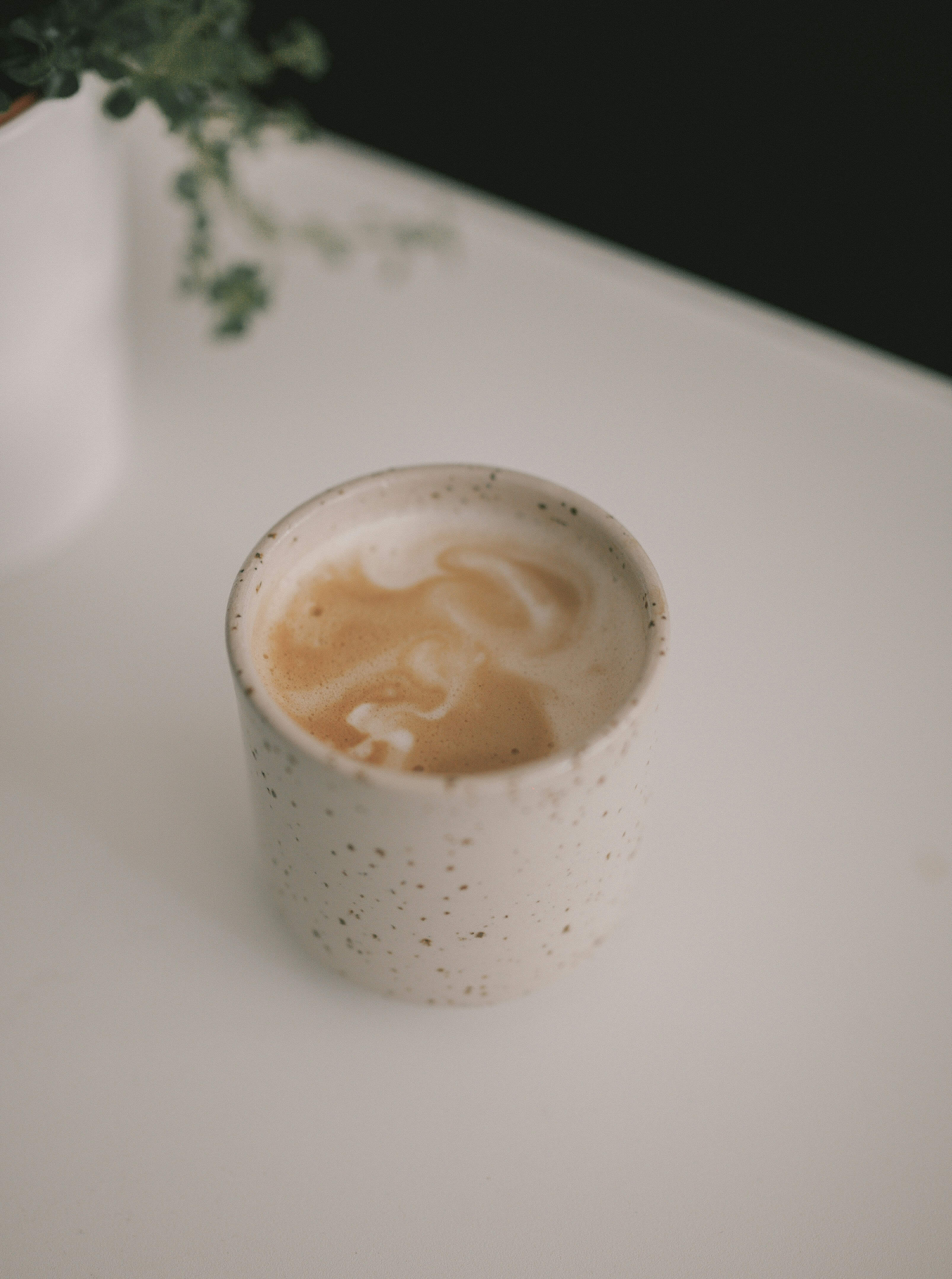 An artistic shot of a flat white, famous coffee in Wellington